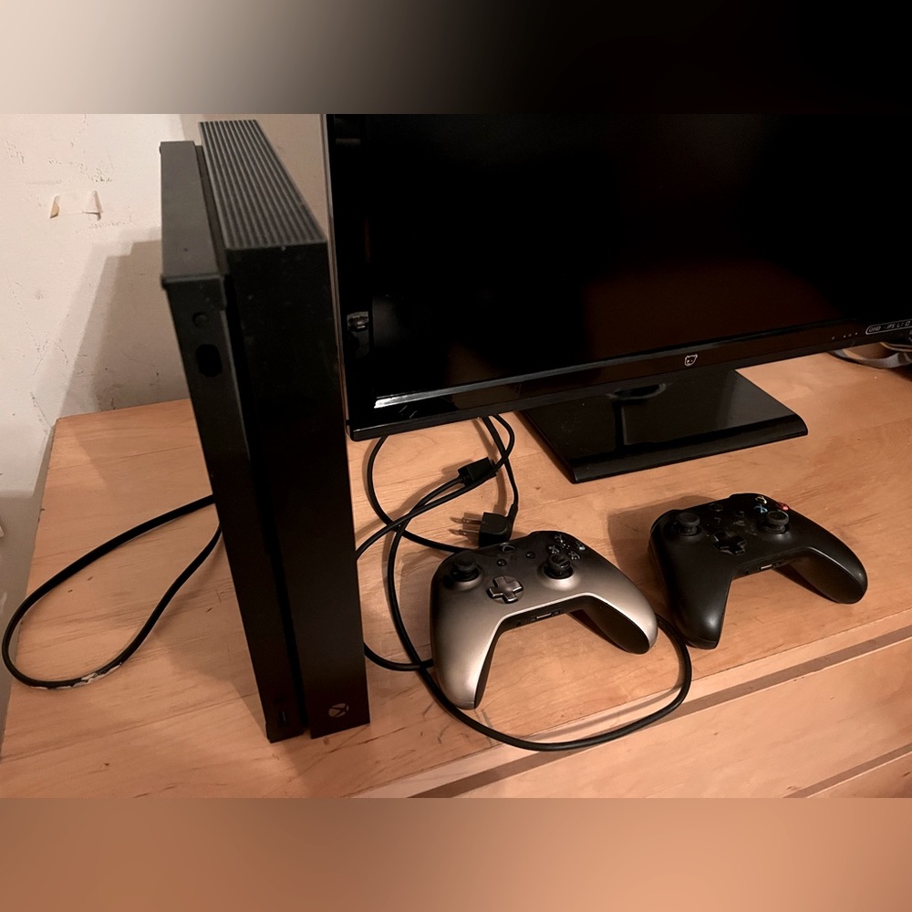 Microsoft XBox One with two controllers and cables